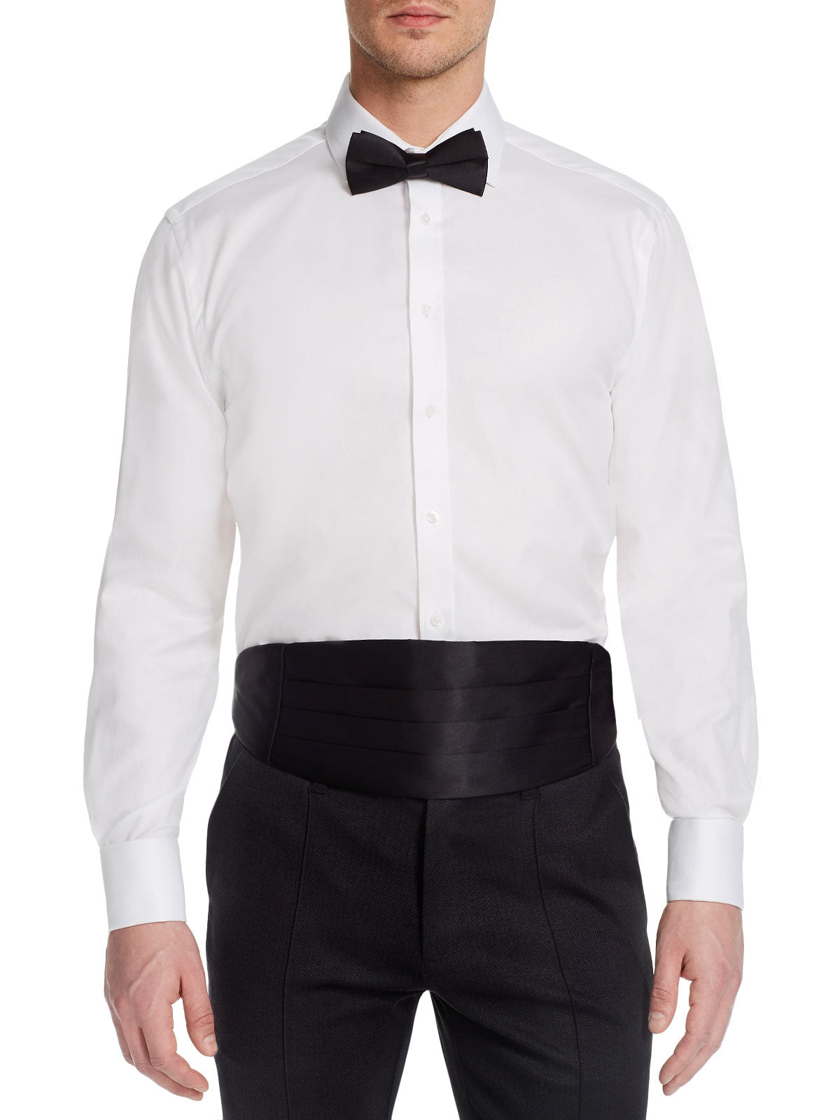 White dress shirt with black bow tie and cummerbund on a white background